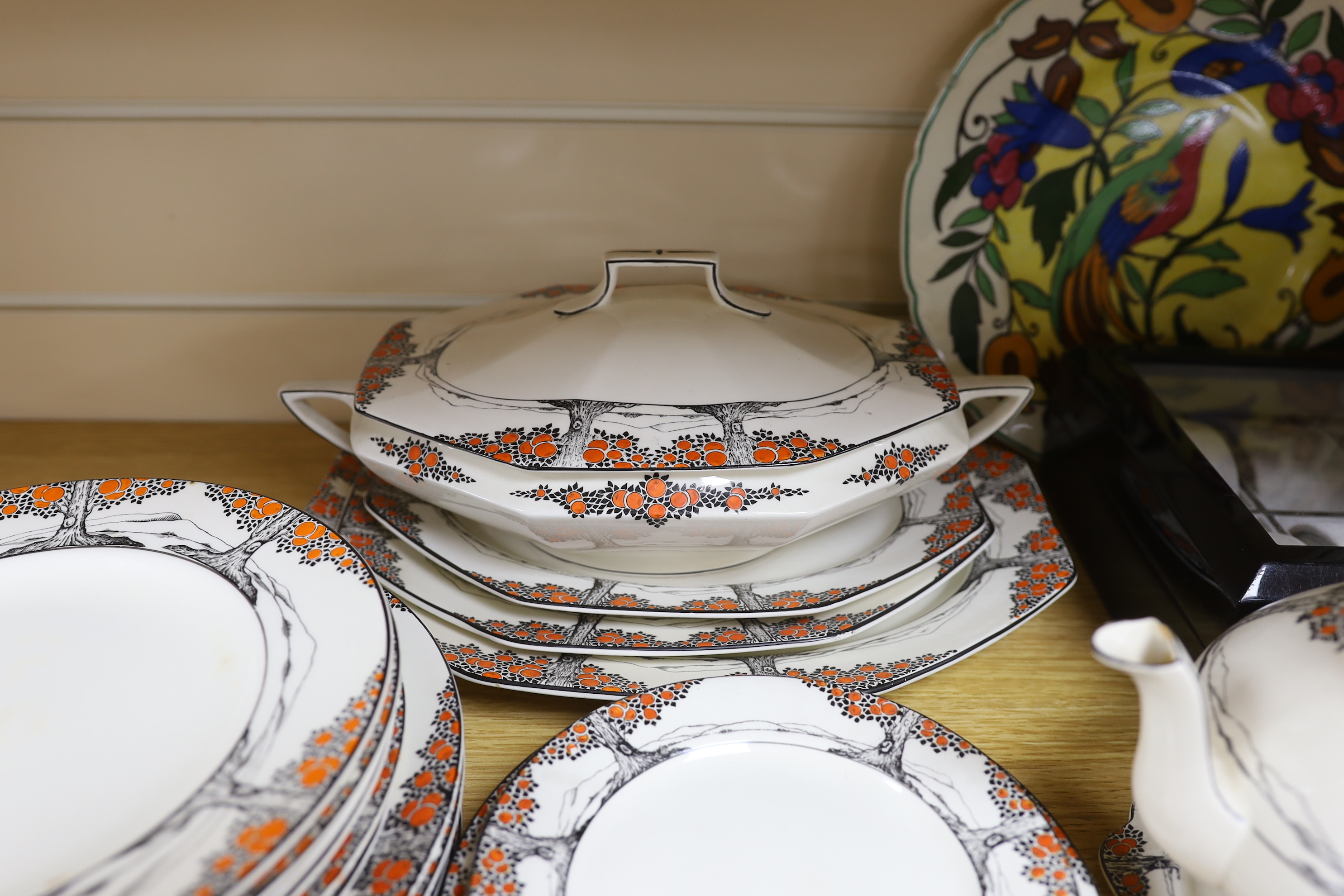 A Crown Ducal orange tree pattern part dinner set including tureens, side plates and jug, together with a Royal Doulton plate, largest 32cm wide